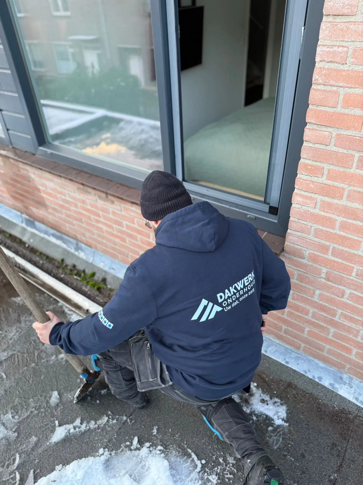 Roofer inspecting different types of roof leaks on a Dutch property